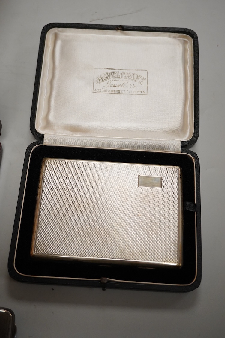 A cased engine turned sterling cigarette case, 11.4cm, a George V silver cigarette case and a cased commemorative limited edition silver gilt Churchill Centenary Picture Medal.
